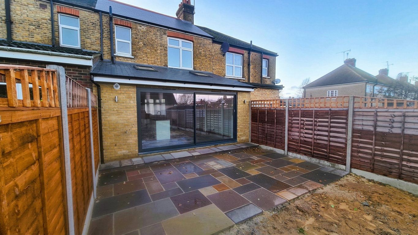 House extension by DM Construction – photo 1 Newly built rear house extension with patio